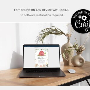 Puede incluir: Una pantalla de computadora port&aacute;til que muestra una invitaci&oacute;n imprimible para un baby shower con un granero rojo, animales de granja y el texto "baby shower". La invitaci&oacute;n se puede personalizar a trav&eacute;s del sitio web Corjl.