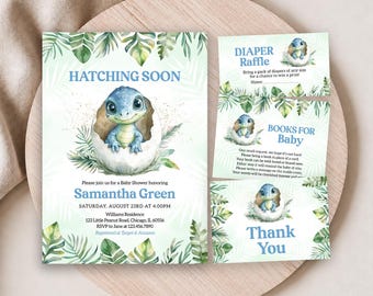 May include: A baby shower invitation set featuring a blue dinosaur hatching from an egg, surrounded by green tropical leaves. The text includes HATCHING SOON, Samantha Green, Saturday, August 23rd at 4:00PM, Diaper Raffle, Books for Baby, and Thank You.