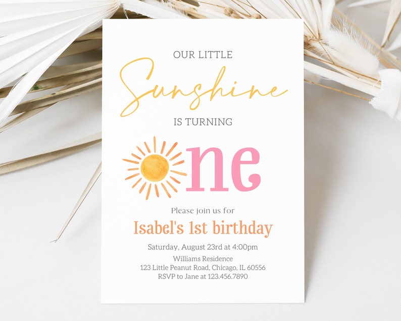 May include: A yellow and orange sun with rays, a pink "one" and the text "Our Little Sunshine is Turning" and "Isabel's 1st birthday" on a white background. The invitation includes the date, time, location, and RSVP information.