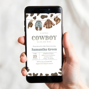May include: A digital baby shower invitation displayed on a smartphone screen featuring a brown cow print border, illustrations of western clothing on a clothesline, and the text A LITTLE COWBOY IS ON HIS WAY honoring Samantha Green on October 25.