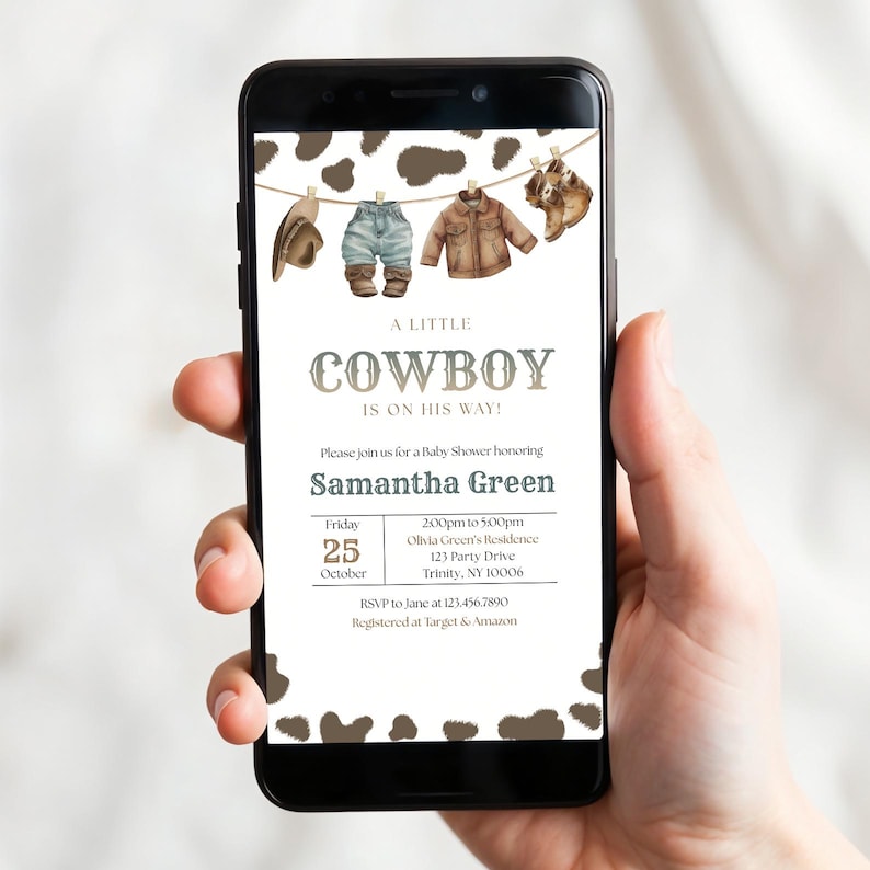 May include: A digital baby shower invitation displayed on a smartphone screen featuring a brown cow print border, illustrations of western clothing on a clothesline, and the text A LITTLE COWBOY IS ON HIS WAY honoring Samantha Green on October 25.