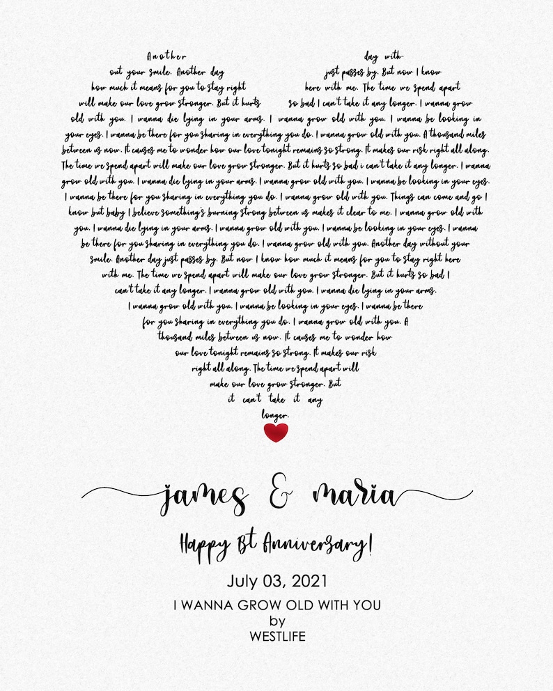 May include: A heart-shaped print with song lyrics, a red heart, and the names "James & Maria." The text reads "Happy 1st Anniversary!" and "July 03, 2021." The song title is "I Wanna Grow Old With You" by Westlife.