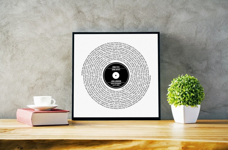 May include: A black and white printable art print of a vinyl record with the lyrics of a song printed in a spiral pattern. The centre of the record has a black circle with the text "SONG TITLE", "SONG ARTIST", "JOHN JOHNSON", "HAPPY RETIREMENT", and "JULY 16, 2023".