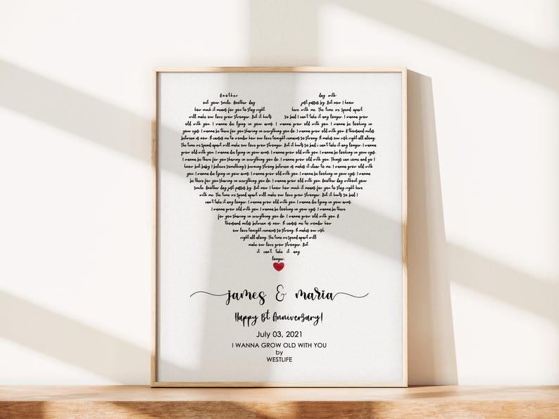 May include: Framed print with a heart-shaped design filled with song lyrics. The print includes the names "James & Maria", "Happy 8th Anniversary!", and the date "July 03, 2021". The song title "I Wanna Grow Old With You" is also featured.