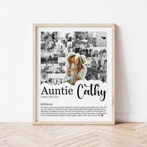 May include: A framed black and white photo collage with the text "Auntie Cathy". The collage features multiple small photos surrounding a central image of a woman and child. The definition of "Auntie" is also included.