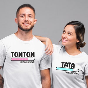 May include: Two white t-shirts with a progress bar graphic. The shirt on the left says "Tonton en chargement..." and the shirt on the right says "Tata en chargement..."