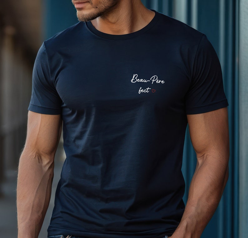 May include: A navy blue t-shirt with the text "Beau-Pere fect" in white with a small red heart.