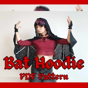 May include: A black crochet bat hoodie with a white crochet design. The hoodie has a hood and long sleeves. The text "Bat Hoodie PDF Pattern" is written in red letters below the image.