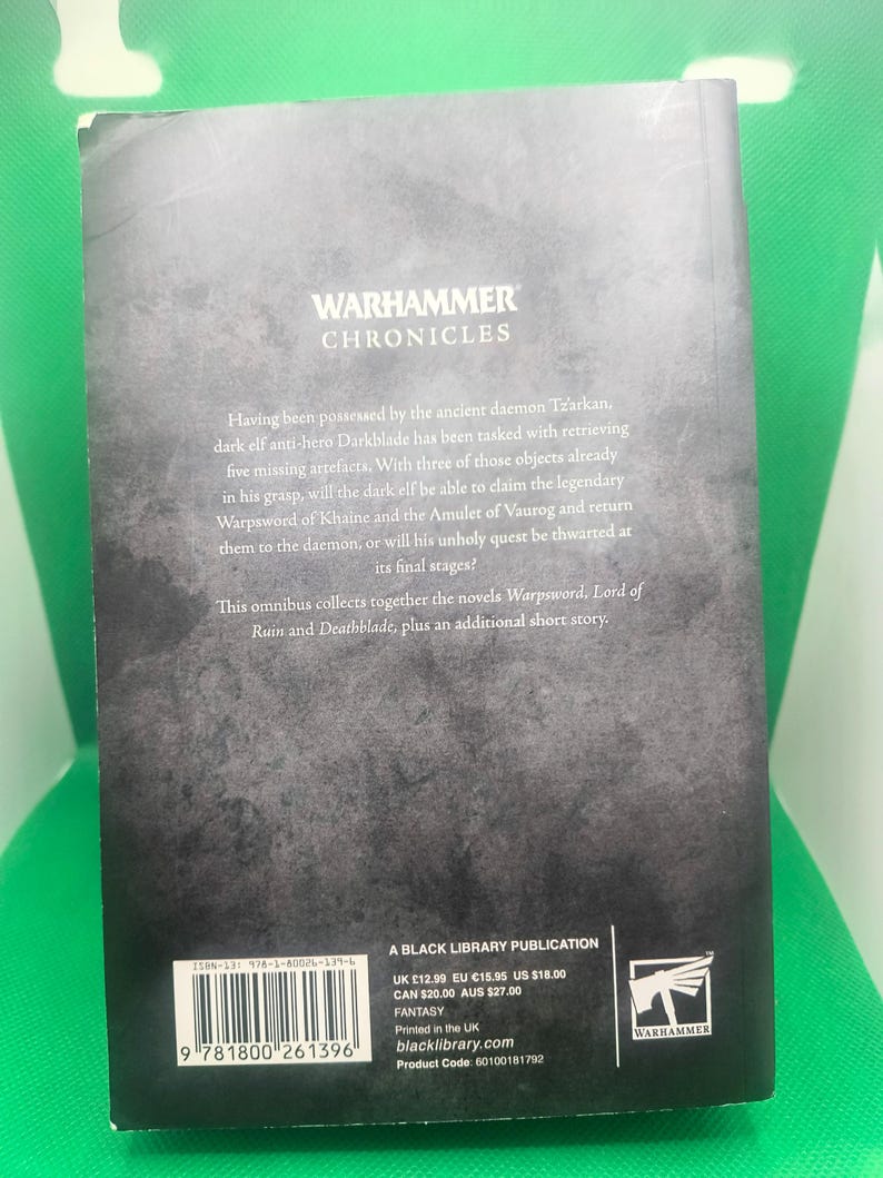 May include: A black book cover with the title "Warhammer Chronicles" and a description of the book's contents. The back cover also includes the book's ISBN, price, and publisher information.
