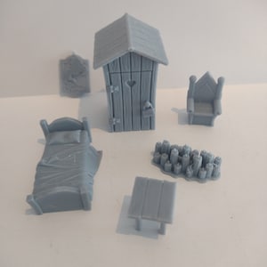 May include: A set of miniature furniture pieces for a dollhouse or miniature scene, including a bed, a table, a chair, a outhouse, and a pile of logs. The pieces are all made of a light gray plastic.