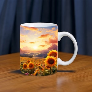 May include: White ceramic mug with a colorful image of a field of sunflowers at sunset. The mug has a white handle.