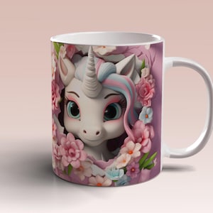 May include: White ceramic mug with a pink and white unicorn illustration. The unicorn has pink and blue hair and is surrounded by pink flowers.