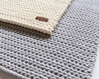 Hand knitted cotton area rug, Chunky grey carpet with a minimalist design, For living room in nordic style.
