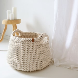 Large cream woven basket, Storage bin for room clothes, Modern laundry hamper with handles, Bathroom organization idea.