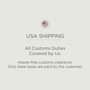 May include: A graphic with the text "USA SHIPPING" and a small American flag icon. The text below states "All Customs Duties Covered by Us. Hassle-free customs clearance. Only state taxes are paid by the customer."