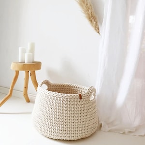 Large cream woven basket, Storage bin for room clothes, Modern laundry hamper with handles, Bathroom organization idea.