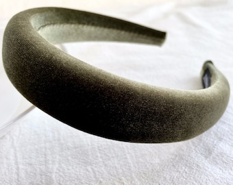 May include: A dark green velvet headband.