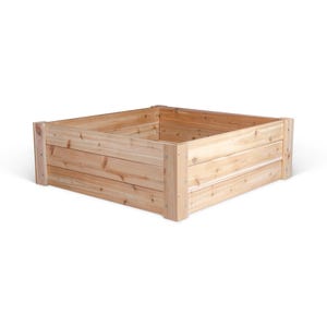 May include: A wooden raised garden bed with a natural finish. The bed is made of cedar wood and has a square shape.