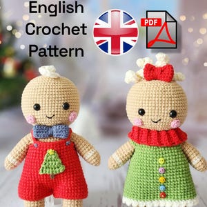 May include: Two crocheted gingerbread dolls, one in red overalls with a green tree, the other in a green dress with colorful buttons. Both have rosy cheeks, black eyes, and a smiling face. The image includes the text "English Crochet Pattern".