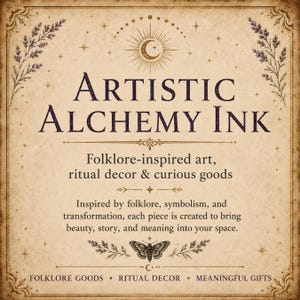 May include: A rectangular sign with a beige parchment background featuring dark brown text that reads Artistic Alchemy Ink, Folklore-inspired art, ritual decor & curious goods, and additional descriptive text, accented by lavender sprigs and a moth.