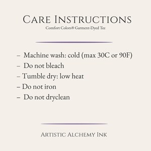May include: Cream-colored graphic with the text "CARE INSTRUCTIONS" and "Comfort Colors&reg; Garment-Dyed Tee." The instructions include machine wash cold (max 90F), do not bleach, tumble dry low heat, do not iron, and do not dry clean. The text "ARTISTIC ALCHEMY INK" is at the bottom.
