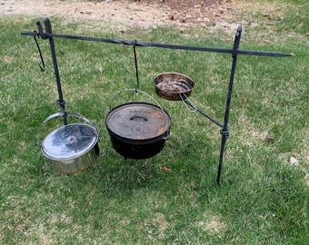 Hand Forged Campfire Cooksets with adjustable swing arms.