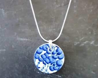 Beautiful Blue Willow pendant on a silver plated snake chain.