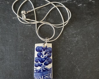 Beautiful Blue Willow pendant on a silver plated snake chain.