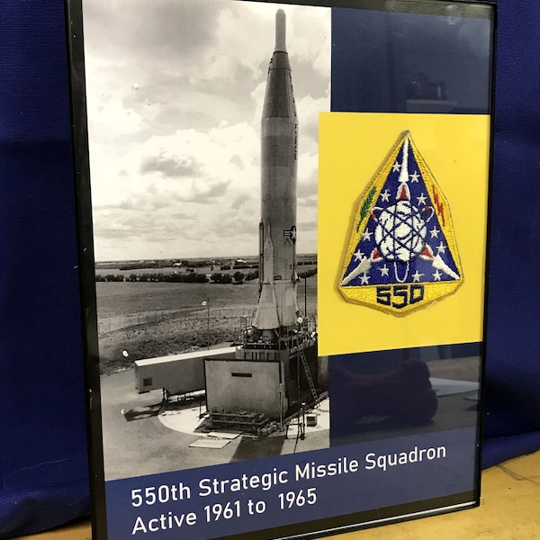 Framed 1960s Atlas Missile display with original vintage patch