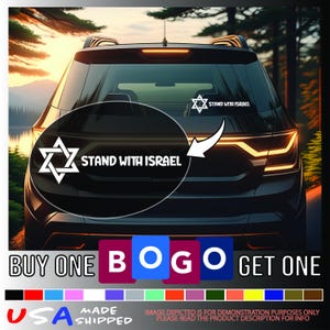 May include: A white vinyl car decal featuring the Star of David and the text "STAND WITH ISRAEL". The decal is shown on the rear window of a black vehicle. The image also includes a "BUY ONE BOGO GET ONE" promotion and "USA MADE SHIPPED" text.