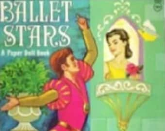 May include: A paper doll book titled "Ballet Stars" featuring a male dancer in a pink and gold costume and a female dancer in a yellow dress. The book has a green background with a decorative border.