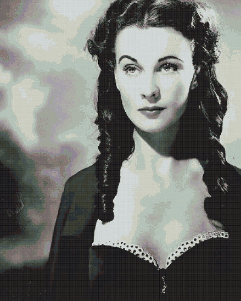 May include: A black and white portrait of a woman with dark hair styled in loose curls. She is wearing a low-cut black dress with a white lace trim.