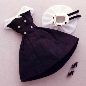 May include: A black dress with a white collar and a white lace overlay. The dress has a fitted bodice and a full skirt. The outfit is completed with a pair of black shoes.
