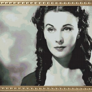 May include: A black and white portrait of a woman with dark hair styled in loose waves. She is wearing a dark dress and has a serious expression on her face.