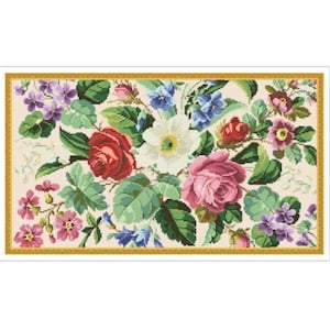 May include: A framed floral embroidery featuring a variety of flowers in shades of pink, red, white, blue, and purple. The flowers are arranged in a bouquet-like design and are surrounded by green leaves.