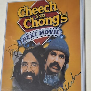 May include: A yellow and red poster with the text "Cheech and Chong's Next Movie" and images of Cheech Marin and Tommy Chong. The poster is signed by both Cheech and Chong.