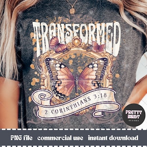 May include: A grey t-shirt with a distressed graphic design featuring a butterfly, a gold frame, and the text "TRANSFORMED 2 CORINTHIANS 3:18".