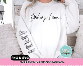 May include: White sweatshirt with the text "God says I am..." in a script font. The left sleeve features the words "Strong, Guided, Loved, Blessed, Forgiven" with Bible verse references. A "Pretty Birdy Designs" logo is visible.