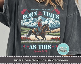May include: Dark gray t-shirt with a graphic of a person riding a horse in front of mountains. Text reads "Perhaps you were born for such times as this" and "Esther 4:14". A Pretty Birdy Designs logo is visible.