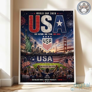 May include: A vertical poster for the World Cup 2026 featuring the text USA in large red, white, and blue letters. The design includes the Statue of Liberty, the Golden Gate Bridge, a soccer stadium, American flags, and the text One Nation. One Team. One Goal.