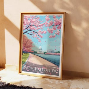 K&ouml;nnte beinhalten: Eine gerahmte Illustration des Washington Monuments in Washington D.C. mit Kirschbl&uuml;ten im Vordergrund. Der Text "WASHINGTON DC UNITED STATES" befindet sich am unteren Rand des Bildes.
