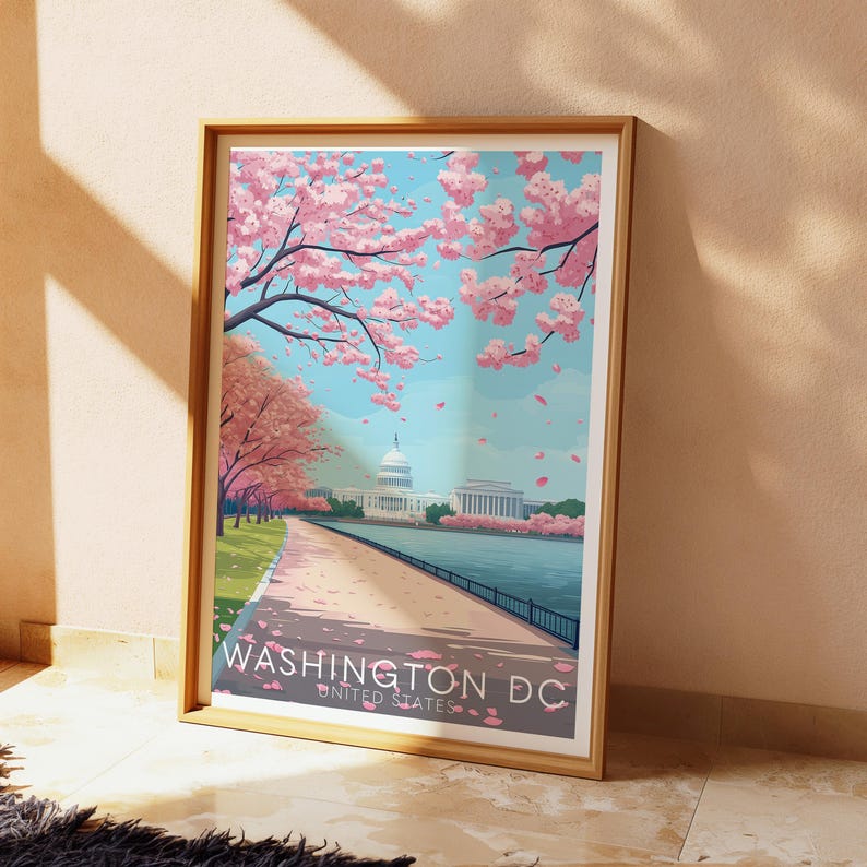 K&ouml;nnte beinhalten: Eine gerahmte Illustration des Washington Monuments in Washington D.C. mit Kirschbl&uuml;ten im Vordergrund. Der Text "WASHINGTON DC UNITED STATES" befindet sich am unteren Rand des Bildes.
