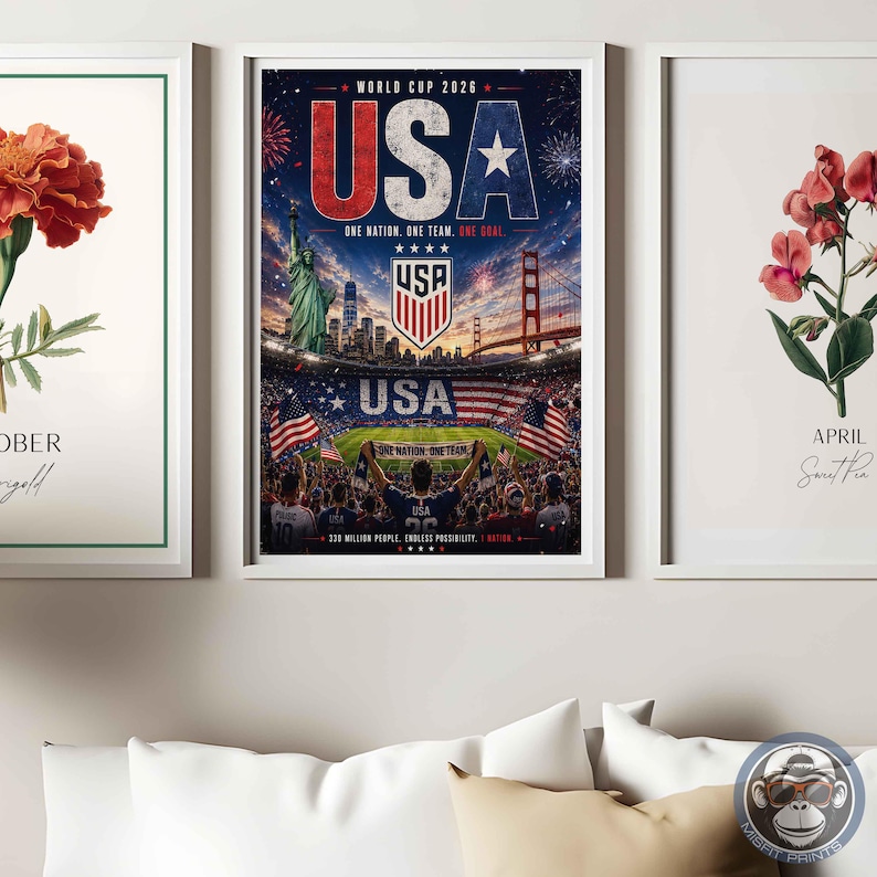 May include: Three framed wall art prints. The left shows an orange marigold flower with the text OCTOBER Marigold. The center features a World Cup 2026 USA poster with the Statue of Liberty, Golden Gate Bridge, and a stadium. The right shows a pink sweet pea flower with the text APRIL Sweet Pea.