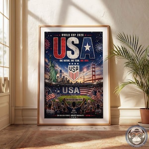May include: A vertical poster titled World Cup 2026 USA featuring a dark blue background with fireworks, the Statue of Liberty, a city skyline, the Golden Gate Bridge, a soccer stadium, the USA crest, and the text One Nation. One Team. One Goal.
