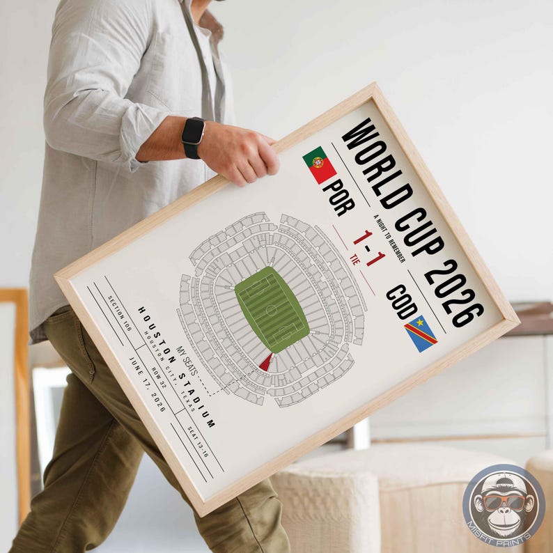 May include: A framed print featuring a World Cup 2026 stadium map for a match between Portugal and DR Congo. The design includes the text World Cup 2026, A Night to Remember, the score 1-1, and details for Houston Stadium, Section 106, Row 37, Seat 13-16.