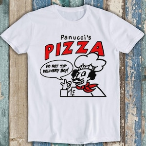 May include: White t-shirt featuring a red and black illustration of a chef with a moustache and a chef's hat. The text "Panucci's Pizza" is above the chef and the text "Do not tip delivery boy!" is in a speech bubble next to the chef.