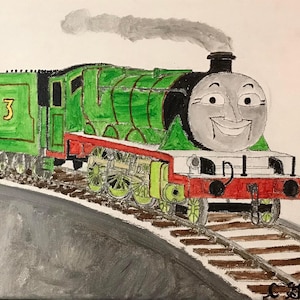 May include: A green and red toy train engine with a smiling face. The engine is numbered "3" and is on a set of train tracks.