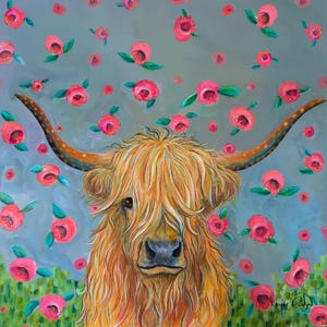 May include: A painting of a Highland cow with long, shaggy, golden fur. The cow is looking directly at the viewer. The background is a light blue with pink flowers falling from the sky.