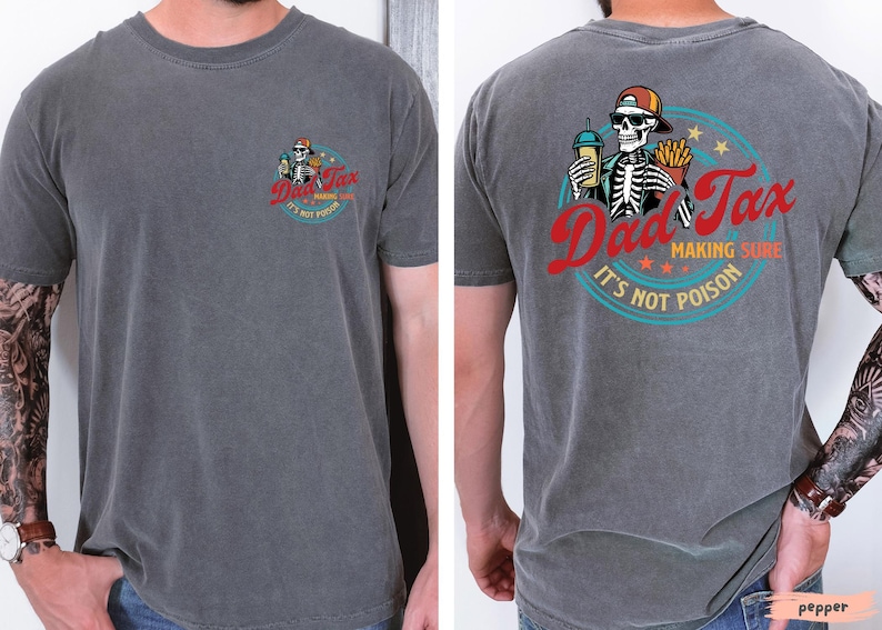 May include: Charcoal gray t-shirt with a graphic on the front and back. The front graphic is a skeleton with a drink and fries, and the text "Dad Tax". The back graphic is a skeleton with a drink and fries, and the text "Dad Tax Making Sure It's Not Poison".