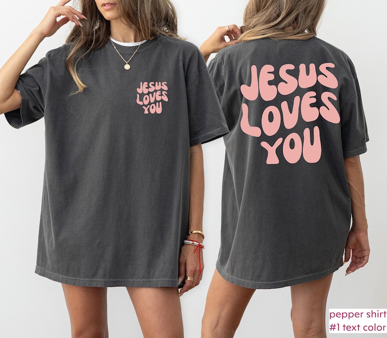 a woman wearing a jesus loves you t - shirt